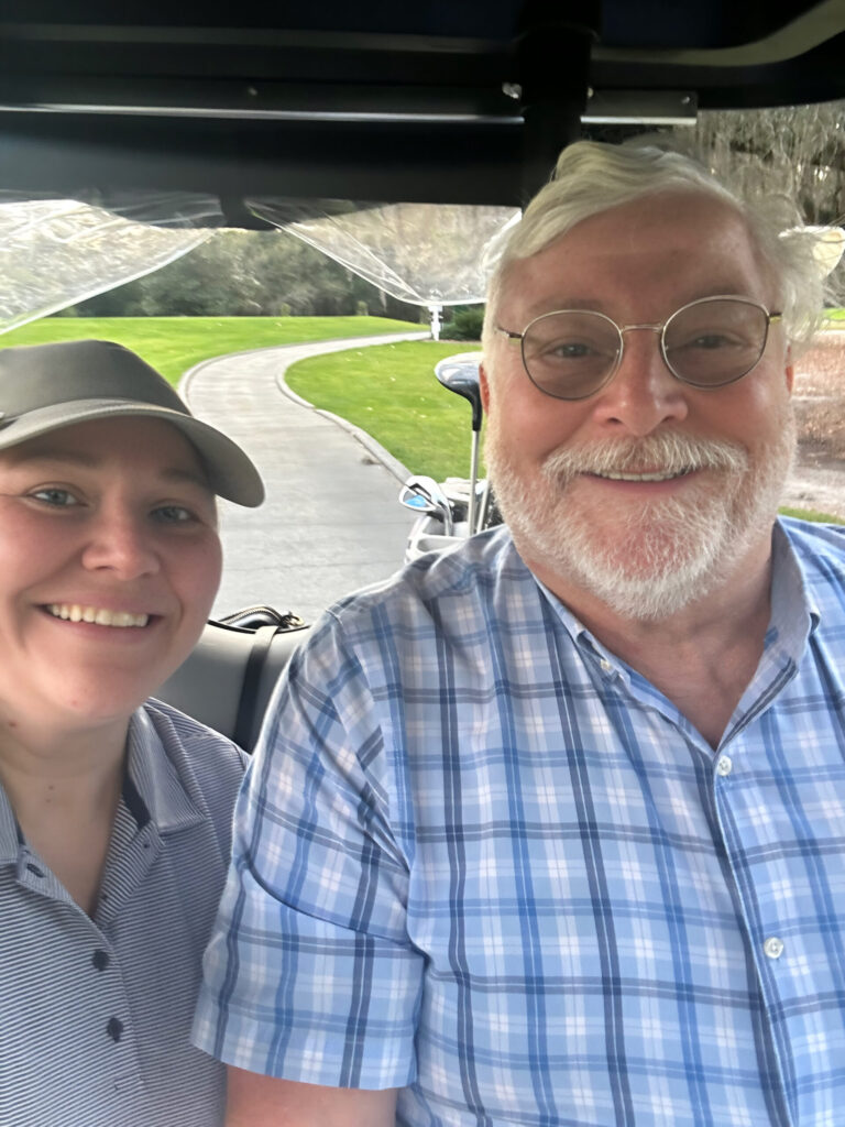 Dad filled the cart cooler with a six-pack before we teed off. He claims my lemonade bottles were too tall to fit anyway. Magnolia course, Disney World, January 2026.